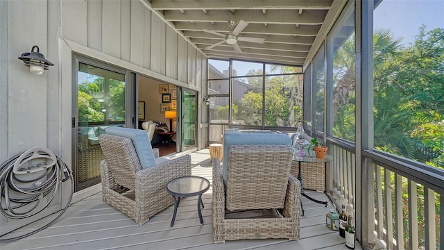 sunroom with a healthy amount of sunlight, lofted ceiling, and ceiling fan