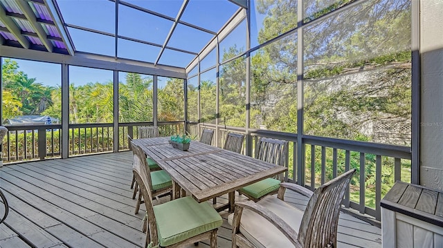 unfurnished sunroom featuring vaulted ceiling