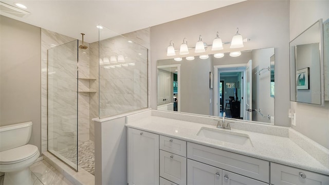 bathroom featuring vanity with extensive cabinet space, an enclosed shower, toilet, and tile floors