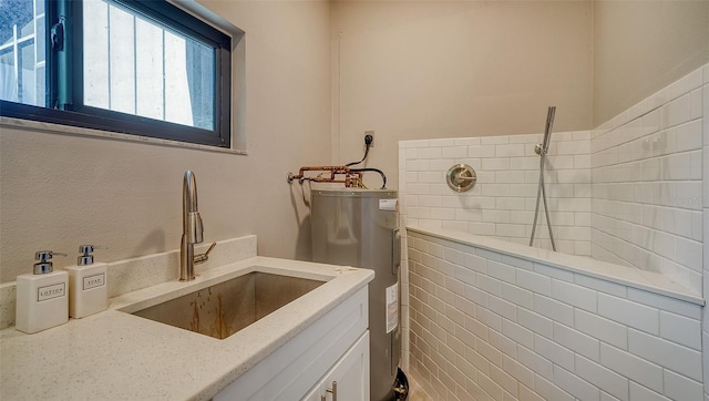 bathroom featuring water heater and vanity