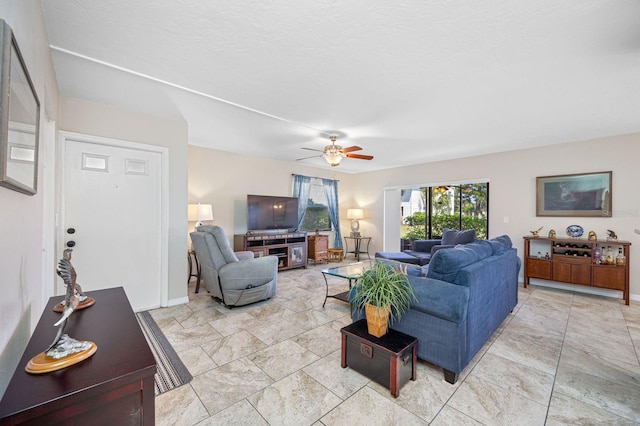 tiled living room featuring ceiling fan