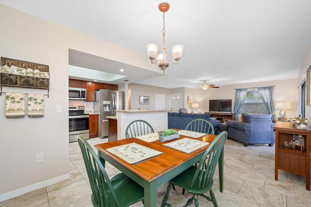 tiled dining room with ceiling fan with notable chandelier