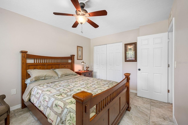 bedroom featuring a closet, ceiling fan, and light tile flooring