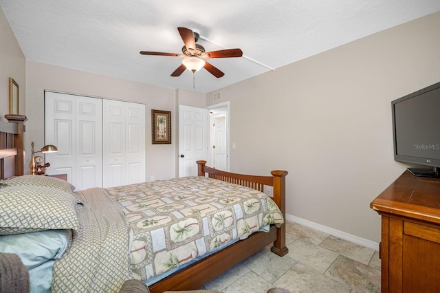 bedroom with a closet, ceiling fan, and light tile floors