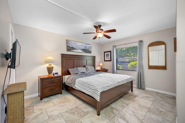 bedroom with ceiling fan and light tile floors