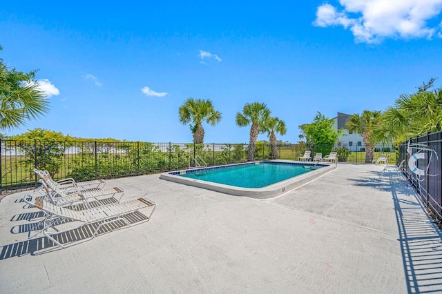 view of swimming pool with a patio area