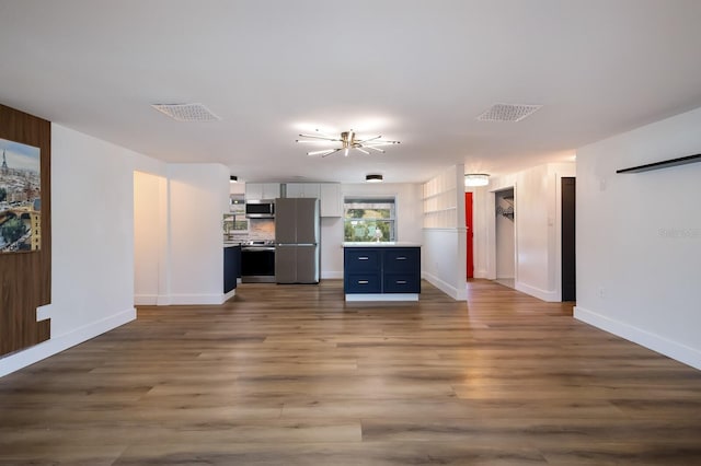 unfurnished living room with wood-type flooring