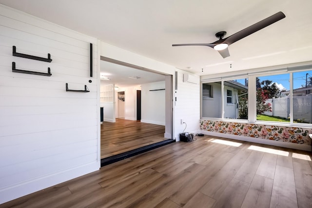 unfurnished room with dark hardwood / wood-style flooring and ceiling fan