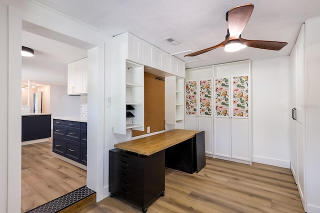 kitchen with white cabinetry, wood counters, light hardwood / wood-style flooring, and ceiling fan