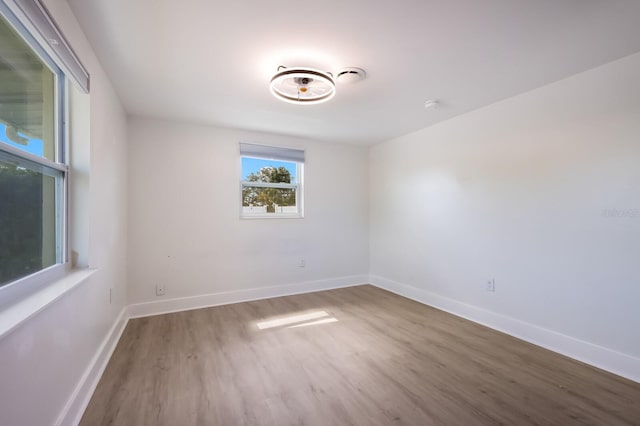 unfurnished room featuring dark hardwood / wood-style floors