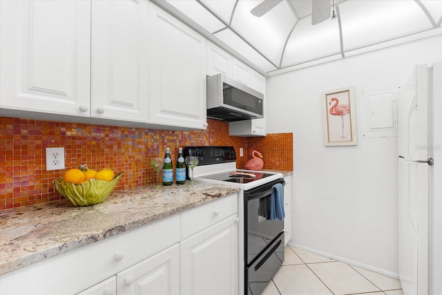 kitchen with white appliances, ceiling fan, tasteful backsplash, white cabinetry, and light tile floors