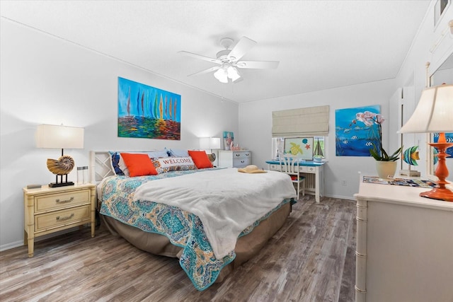 bedroom with ceiling fan and hardwood / wood-style floors