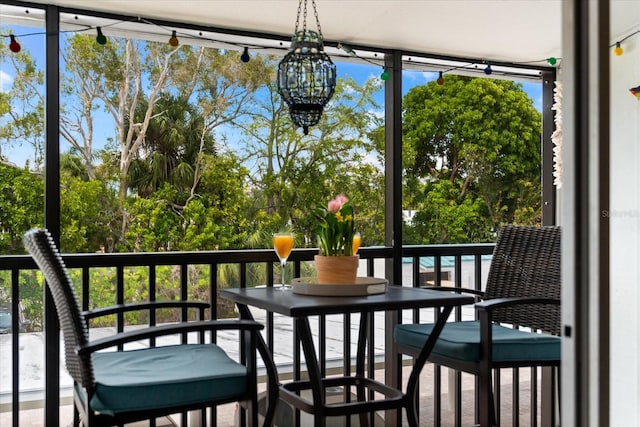 sunroom with an inviting chandelier