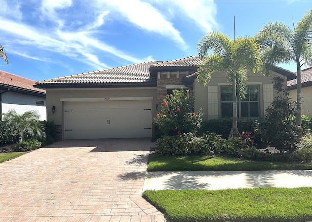 mediterranean / spanish-style house featuring a garage