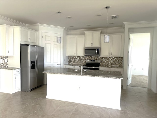 kitchen featuring hanging light fixtures, backsplash, a center island with sink, stainless steel appliances, and light stone counters