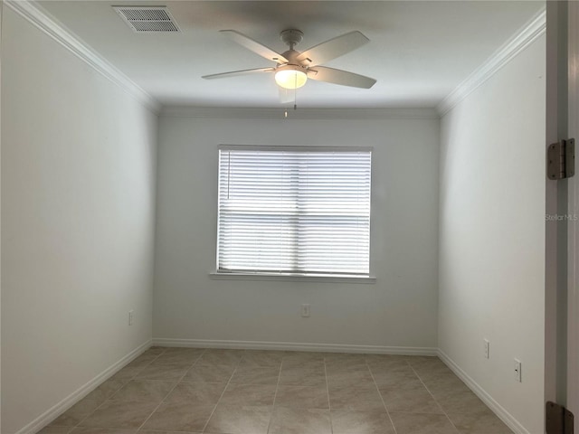 tiled spare room with ceiling fan and crown molding