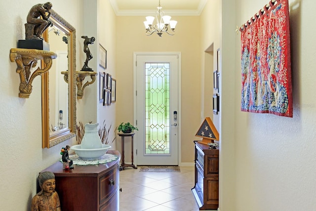 tiled foyer entrance featuring a notable chandelier and ornamental molding