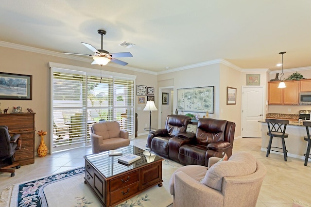 living room featuring ceiling fan, crown molding, and light tile floors