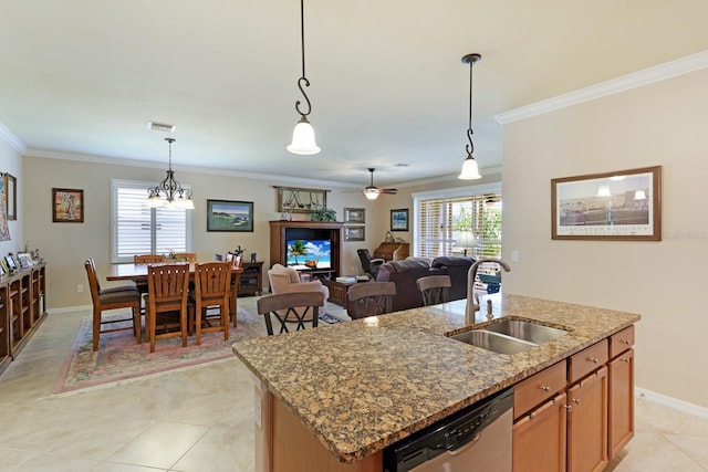 kitchen with pendant lighting, a kitchen island with sink, light stone countertops, sink, and dishwasher