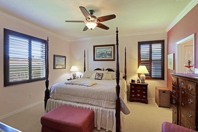 bedroom with crown molding, ceiling fan, and carpet floors