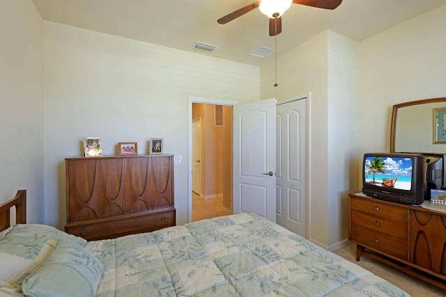 carpeted bedroom with a closet and ceiling fan