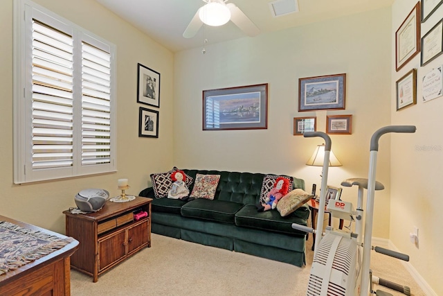 living room with light carpet and ceiling fan