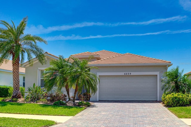 view of front of property with a garage