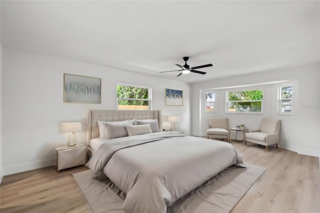 bedroom featuring ceiling fan and light hardwood / wood-style flooring