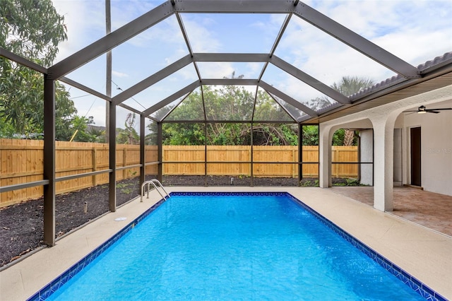 view of pool featuring a patio and glass enclosure