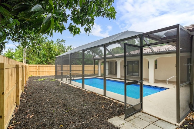 view of pool featuring a patio and a lanai