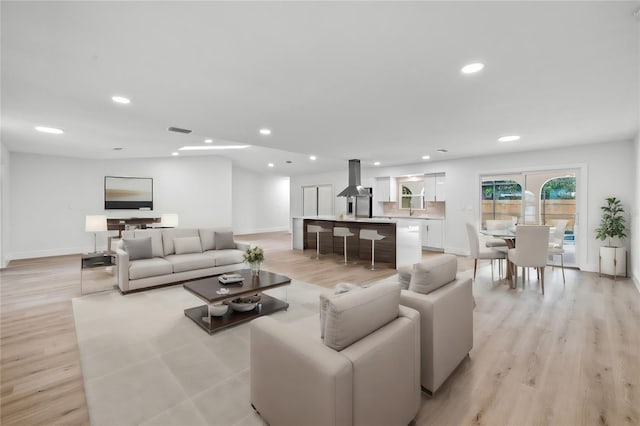 living room with light hardwood / wood-style flooring