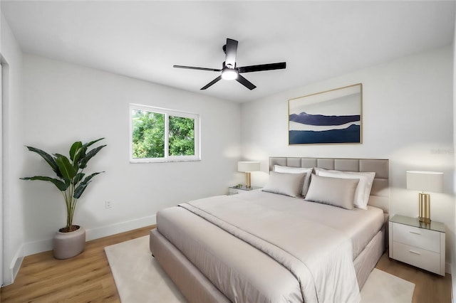 bedroom featuring light wood-type flooring and ceiling fan