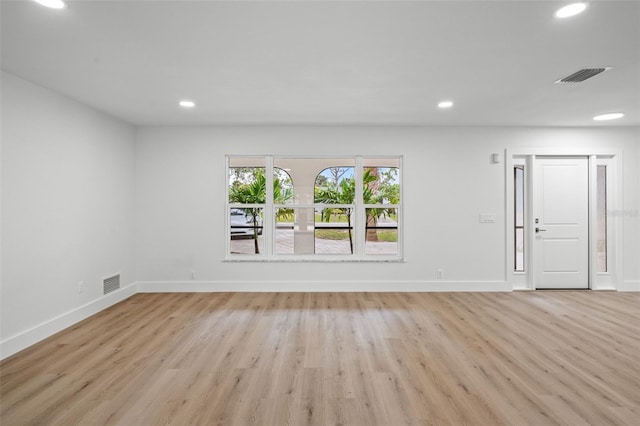 spare room featuring light hardwood / wood-style flooring