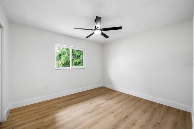 spare room with light hardwood / wood-style flooring and ceiling fan