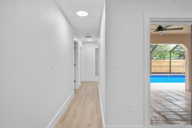 hall with light hardwood / wood-style floors