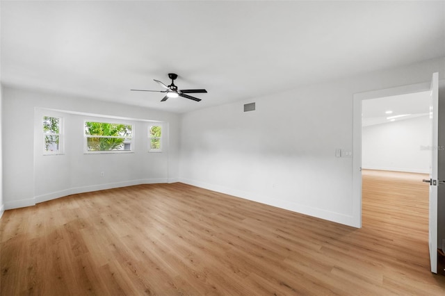 spare room featuring ceiling fan and light wood-type flooring