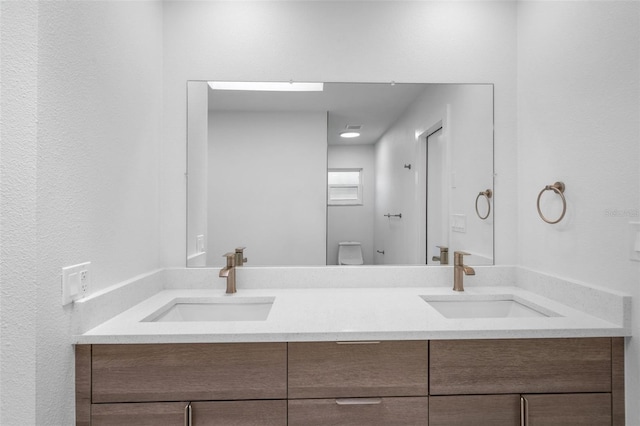 bathroom with dual vanity