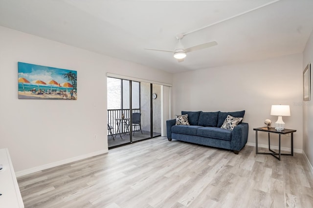 living room featuring light hardwood / wood-style flooring and ceiling fan