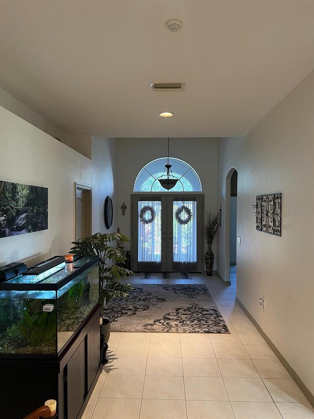 tiled entryway with french doors