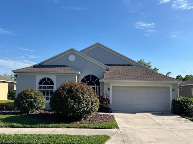 single story home featuring a garage