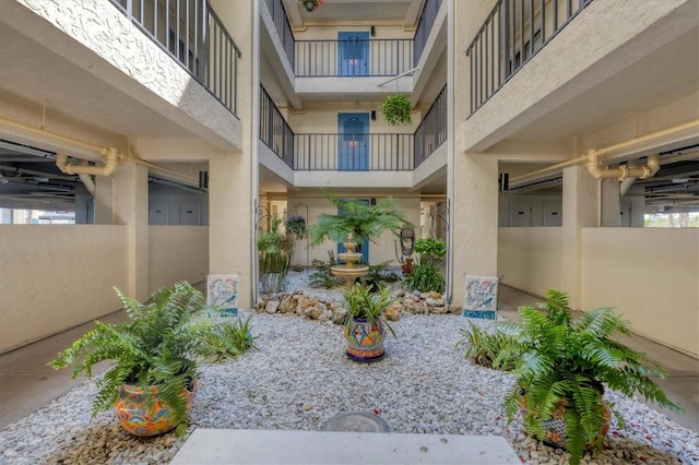 entrance to property featuring a balcony