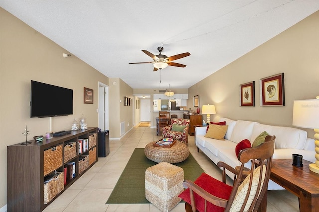 living room with ceiling fan and light tile floors