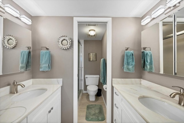 bathroom featuring large vanity, tile floors, and toilet