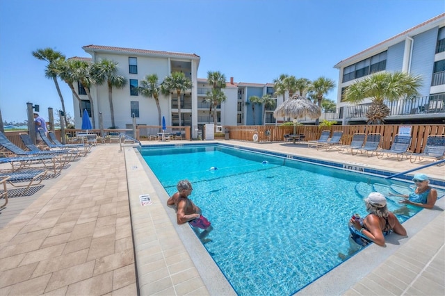 view of swimming pool with a patio