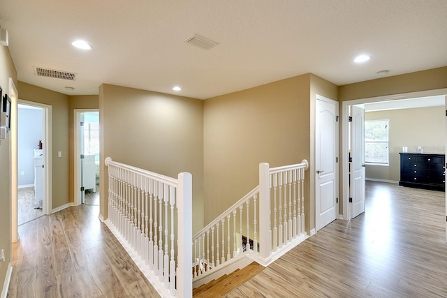 corridor featuring light hardwood / wood-style flooring