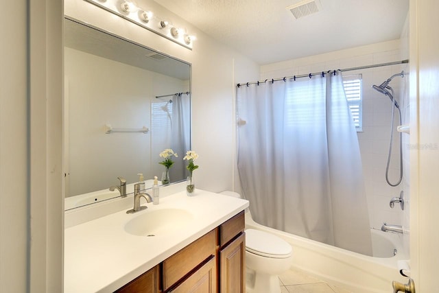 full bathroom with tile flooring, a textured ceiling, shower / tub combo, toilet, and vanity