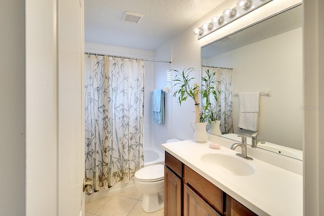 full bathroom featuring shower / tub combo, large vanity, tile flooring, toilet, and a textured ceiling