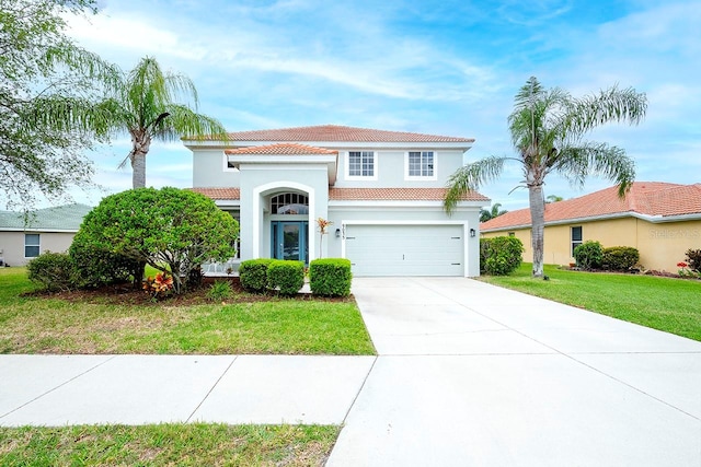 mediterranean / spanish-style home featuring a front lawn