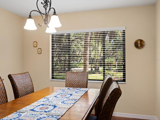 dining room with a notable chandelier