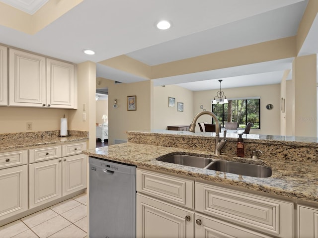 kitchen featuring light stone countertops, decorative light fixtures, sink, light tile floors, and stainless steel dishwasher